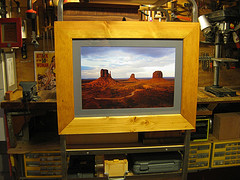 Rustic handcrafted frame for 
Curtis Brown’s stormy view of Monument Valley